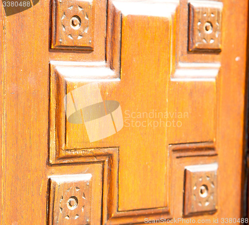 Image of texture of a brown old door in italy europe