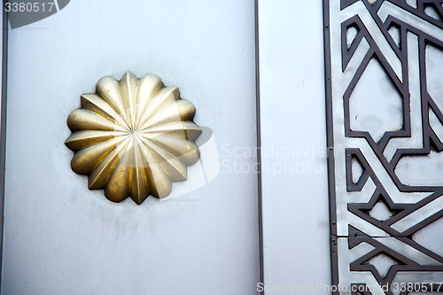 Image of gold  metal rusty   in africa the old wood    safe padlock 