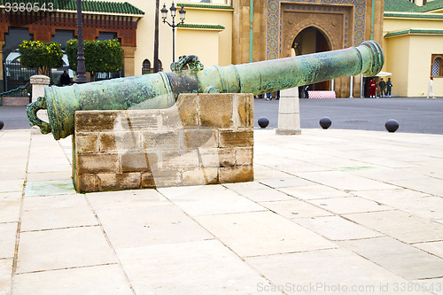 Image of bronze cannon in africa morocco  green  and  