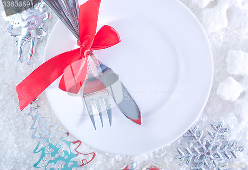 Image of fork and knife on white plate