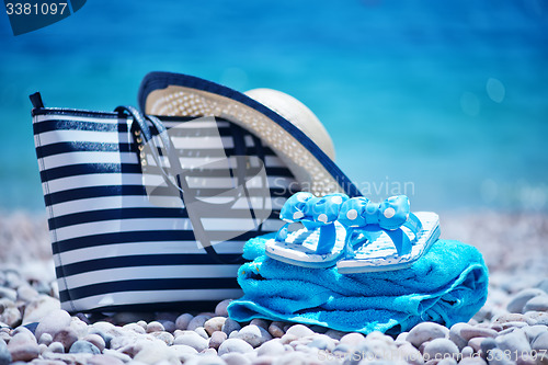 Image of bag and hat on the beach