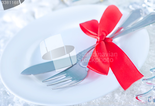 Image of fork and knife on white plate