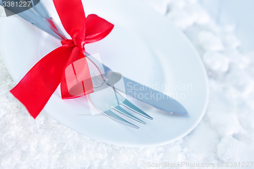 Image of fork and knife on white plate