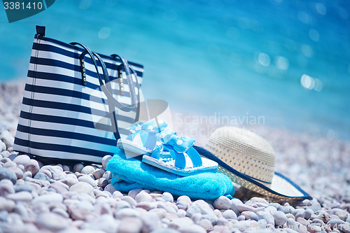 Image of bag and hat on the beach