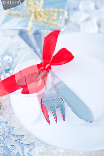 Image of fork and knife on white plate