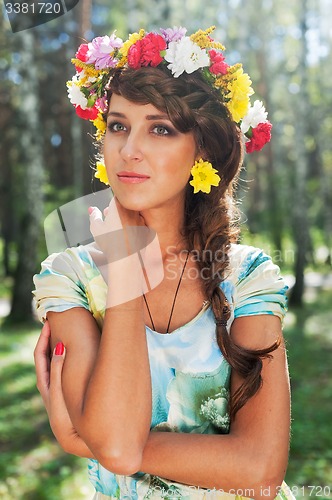 Image of Beautiful woman with flower wreath