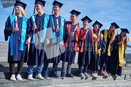 Image of young graduates students group