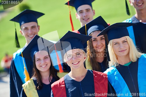 Image of young graduates students group