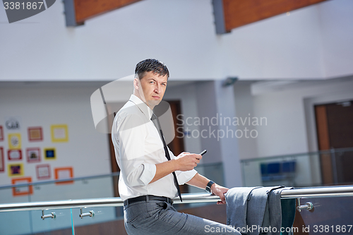 Image of business man using phone