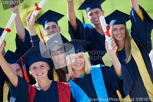 Image of young graduates students group