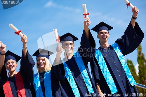 Image of young graduates students group