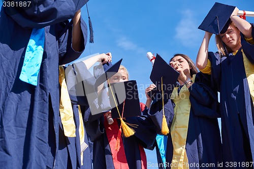 Image of young graduates students group