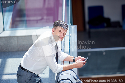 Image of business man using phone
