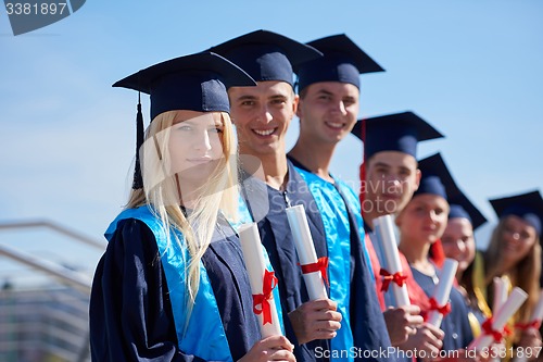 Image of young graduates students group