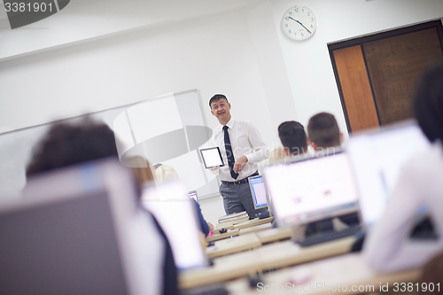 Image of students with teacher  in computer lab classrom