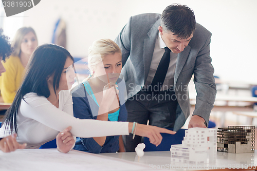 Image of group of students with teacher on class