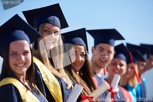 Image of young graduates students group