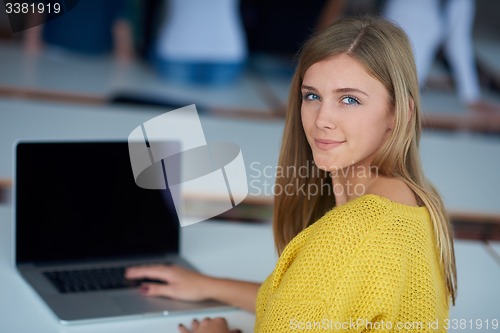 Image of portrait of happy smilling student girl at tech classroom