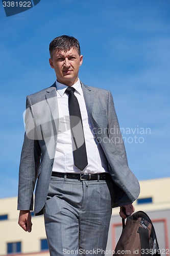 Image of senior  businessman outdoors