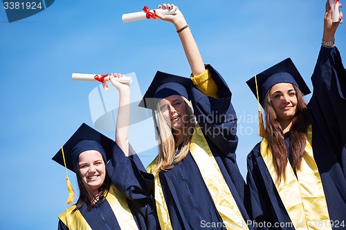 Image of young graduates students group