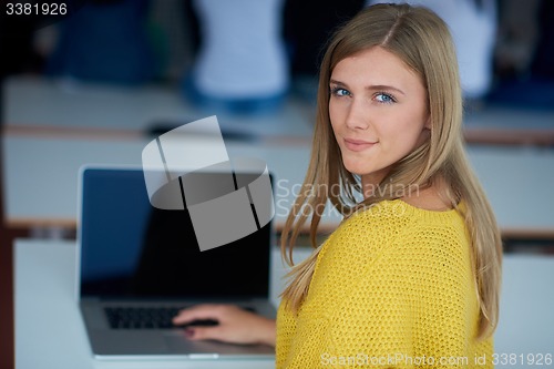 Image of portrait of happy smilling student girl at tech classroom
