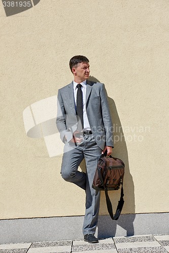 Image of senior  businessman outdoors