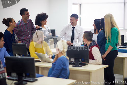 Image of students with teacher  in computer lab classrom