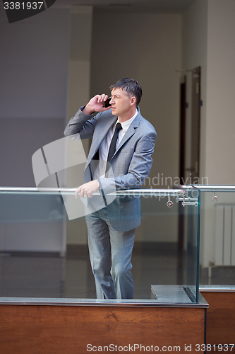 Image of business man using phone