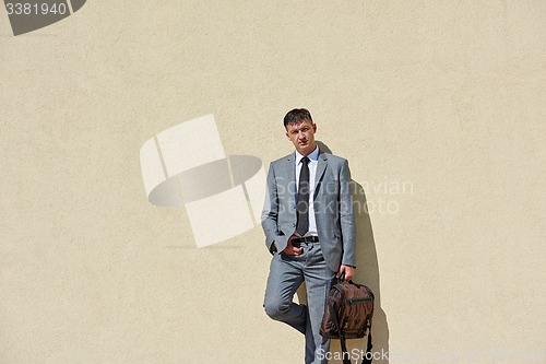 Image of senior  businessman outdoors