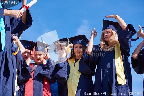 Image of young graduates students group