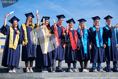 Image of young graduates students group