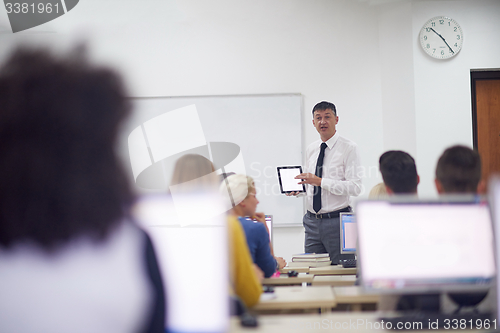 Image of students with teacher  in computer lab classrom