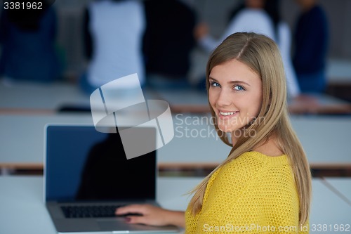 Image of portrait of happy smilling student girl at tech classroom