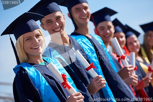 Image of young graduates students group