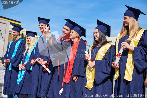 Image of young graduates students group