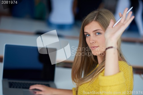 Image of portrait of happy smilling student girl at tech classroom