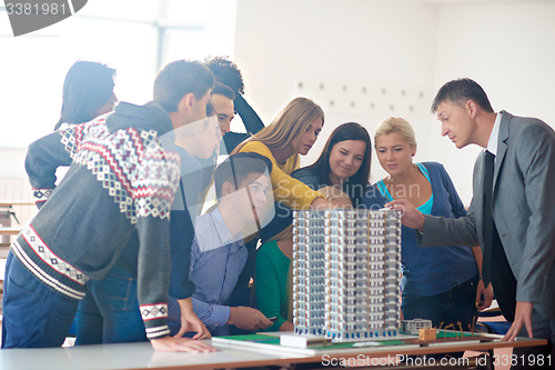 Image of group of students with teacher on class