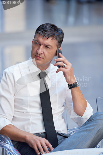 Image of business man using phone