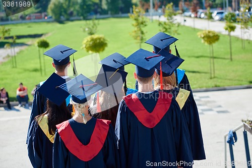 Image of young graduates students group