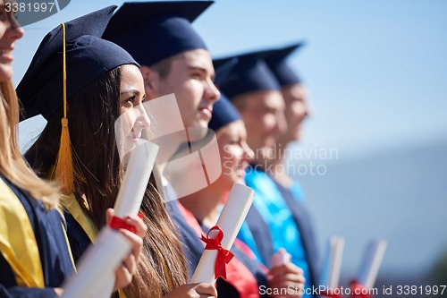 Image of young graduates students group