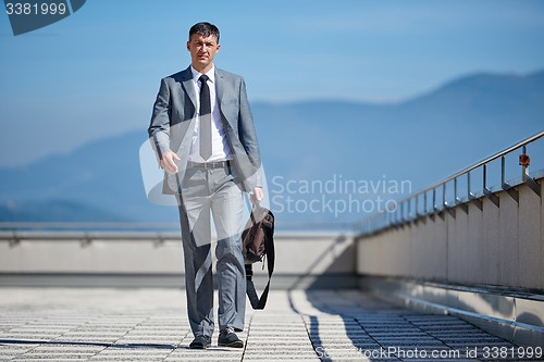 Image of senior  businessman outdoors