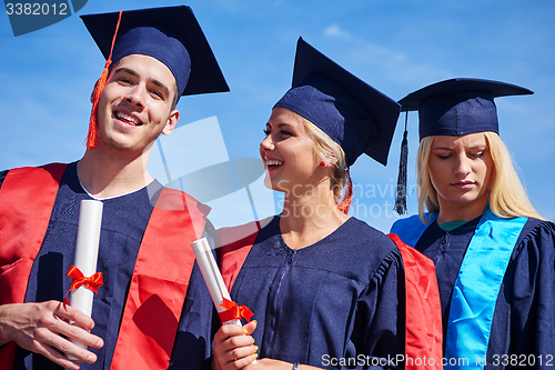 Image of young graduates students group