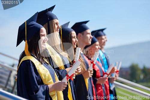 Image of young graduates students group