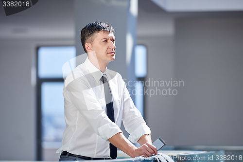 Image of business man using phone