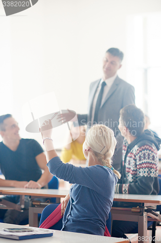 Image of group of students with teacher on class