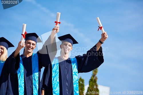 Image of young graduates students group