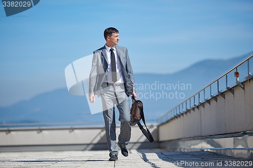 Image of senior  businessman outdoors