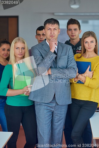 Image of group portrait of teacher with students