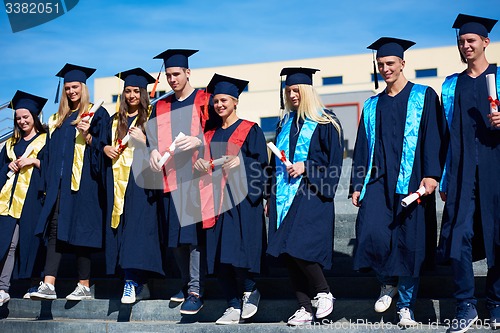 Image of young graduates students group