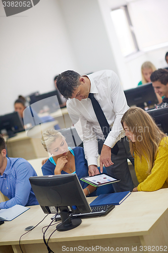 Image of students with teacher  in computer lab classrom